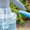 Gray Manual Pressure Garden Sprayer with Teal Nozzle